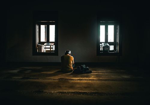 Calm person meditating in a quiet room